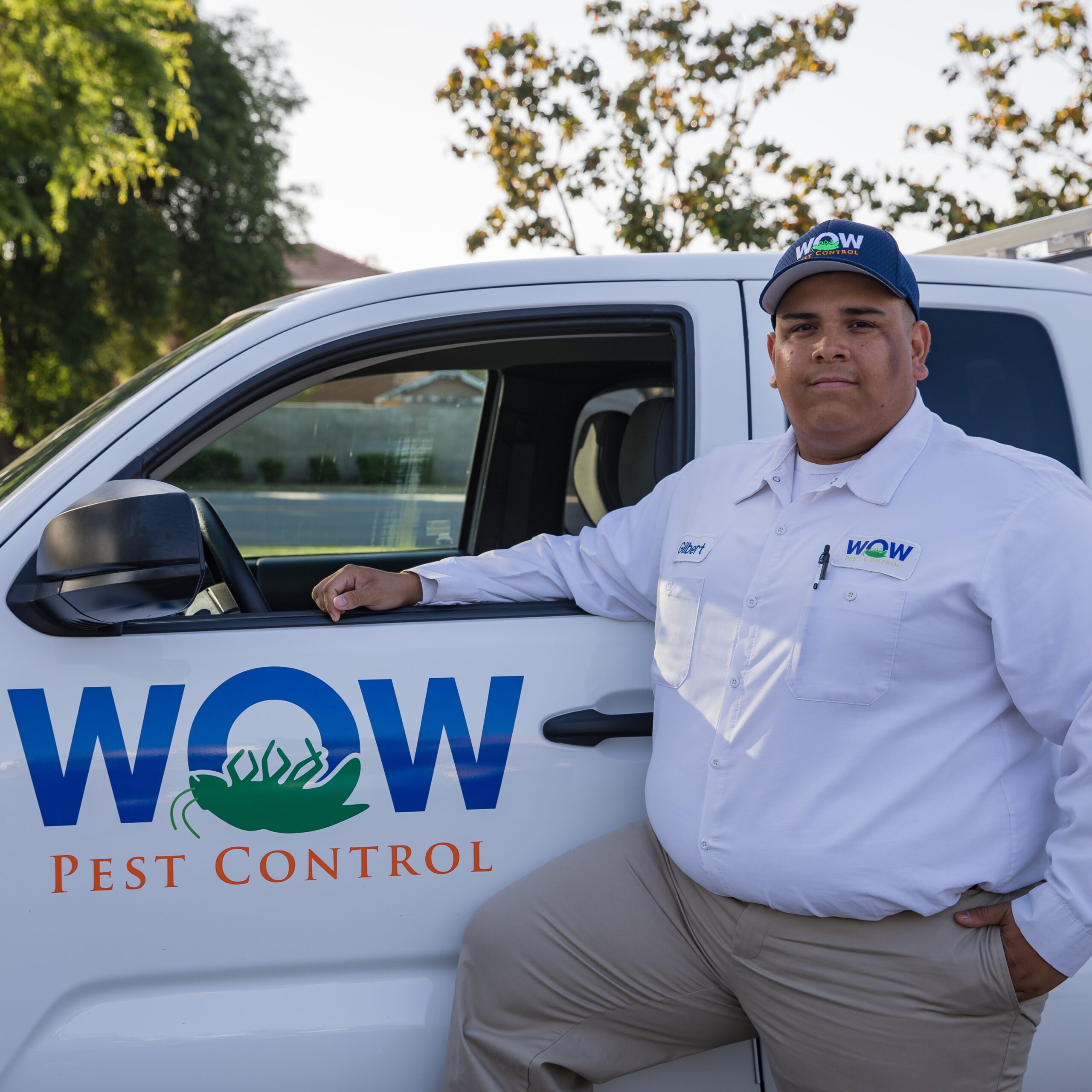 Picture of Wow Pest Control Pest Control Service Expert, Hilberto Lopez, next to a company truck.