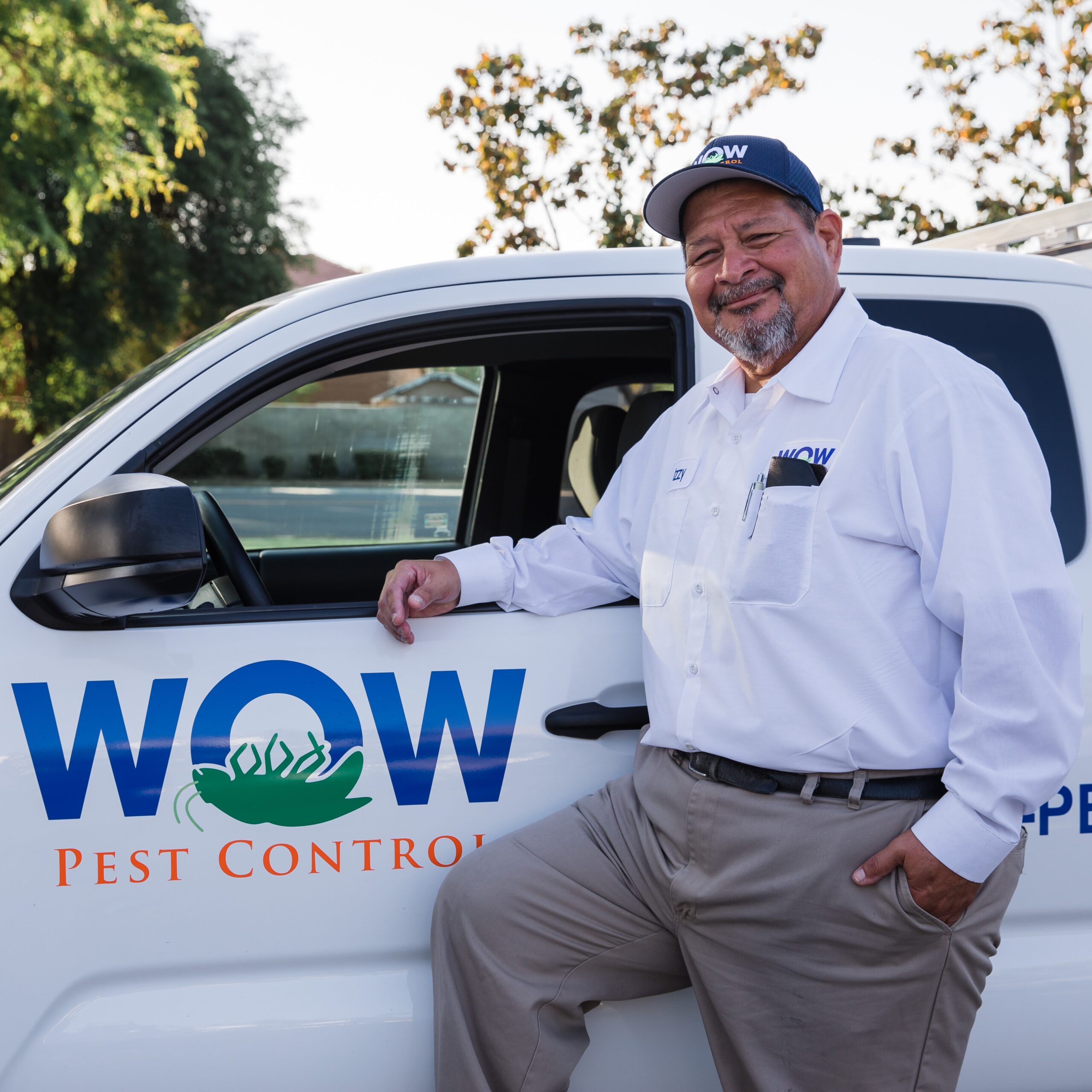 Picture of Wow Pest Control Pest Control Service Expert, Ismael Hernandez, next to a company truck.