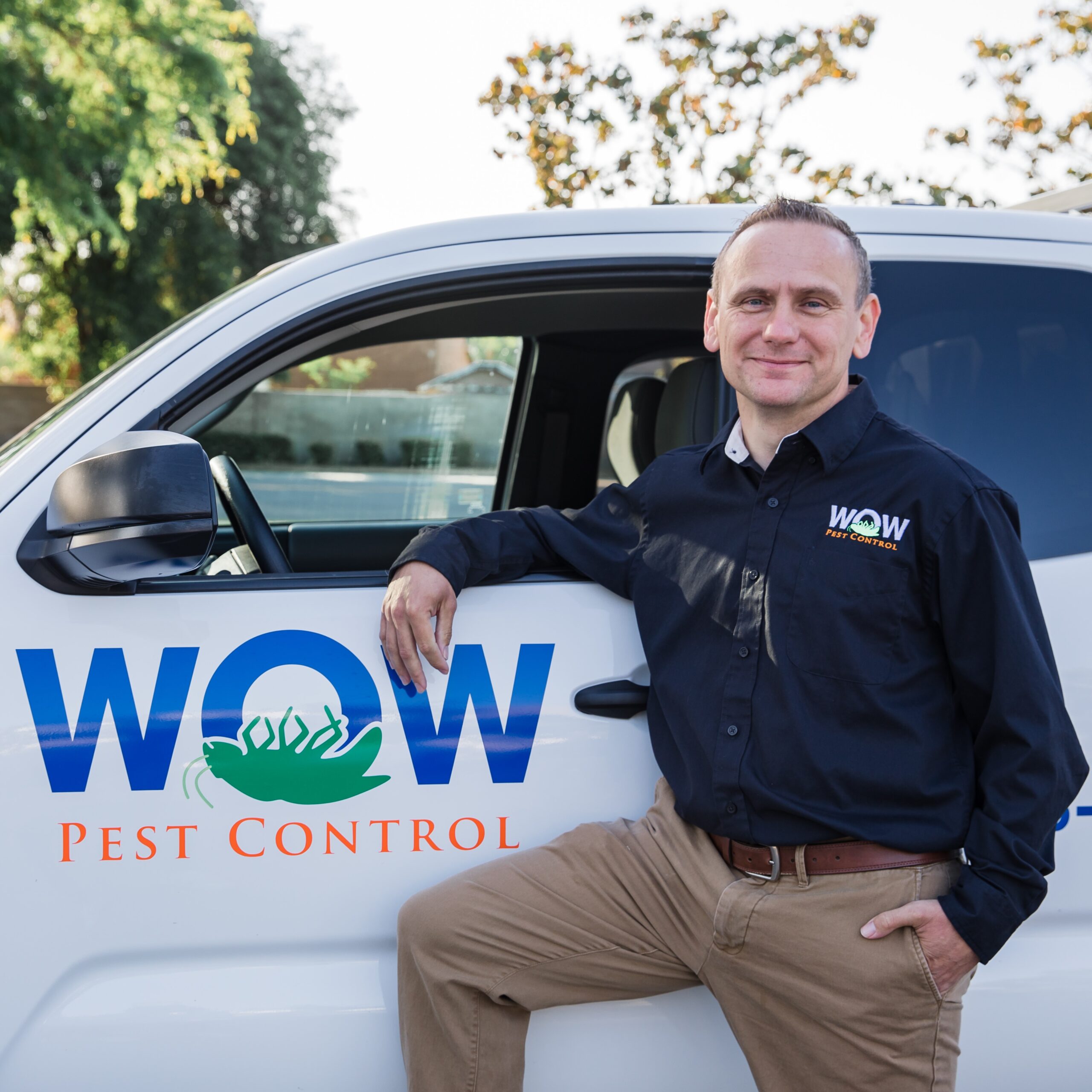 Picture of Wow Pest Control Office Manager, John Westwood, next to a company truck.