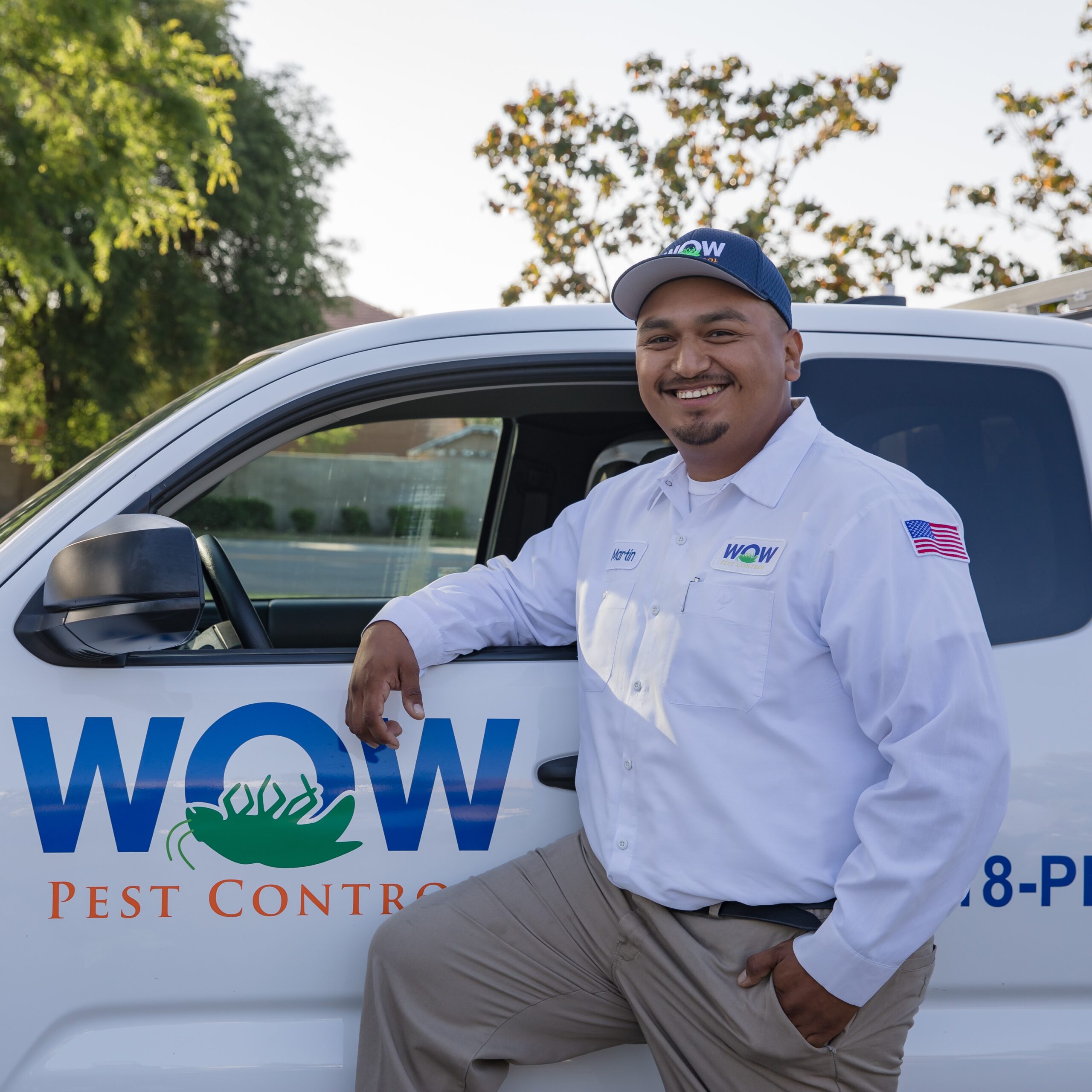 Picture of Wow Pest Control Pest Control Service Expert, Martin Montes, next to a company truck.