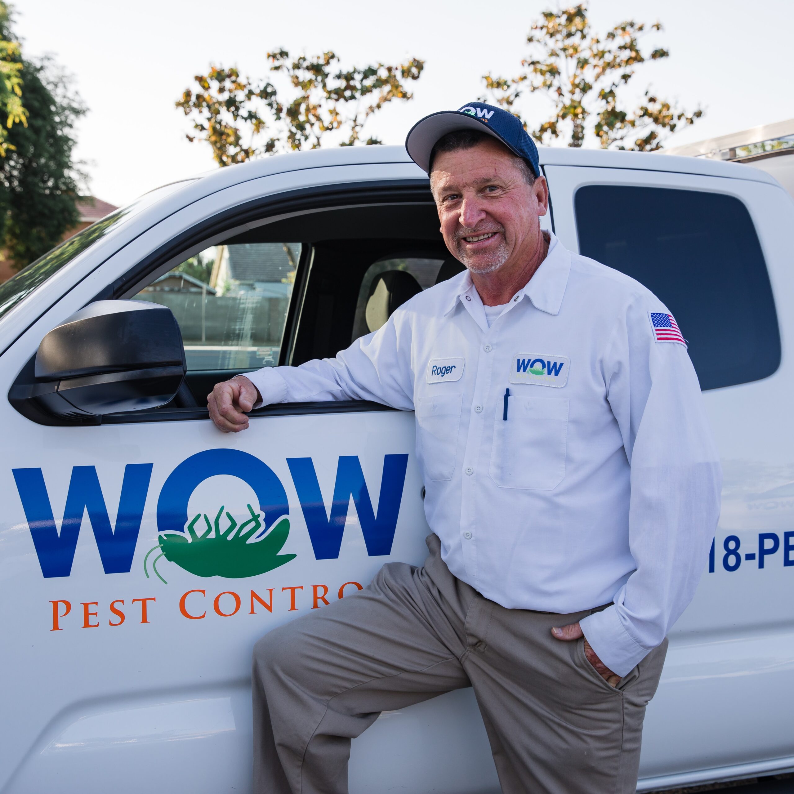 Picture of Wow Pest Control Pest Control Service Expert, Roger Hewes, next to a company truck.